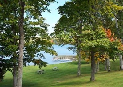 Sunset Lake picnic tables along shore